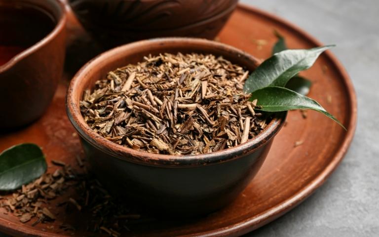Loose-leaf hojicha tea in a bowl.