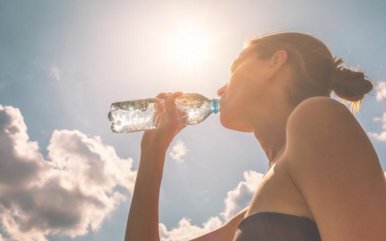 Woman drinking water for hydration